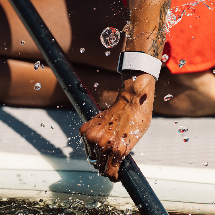 Hydroknit Band for WHOOP® 4.0 – a water-resistant band designed for intense activities, shown during kayaking. Available at Strapcostore